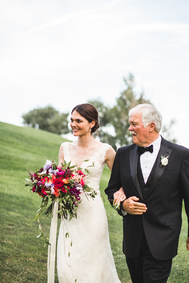 dad walking bride down the aisle on wedding day in denver colorado